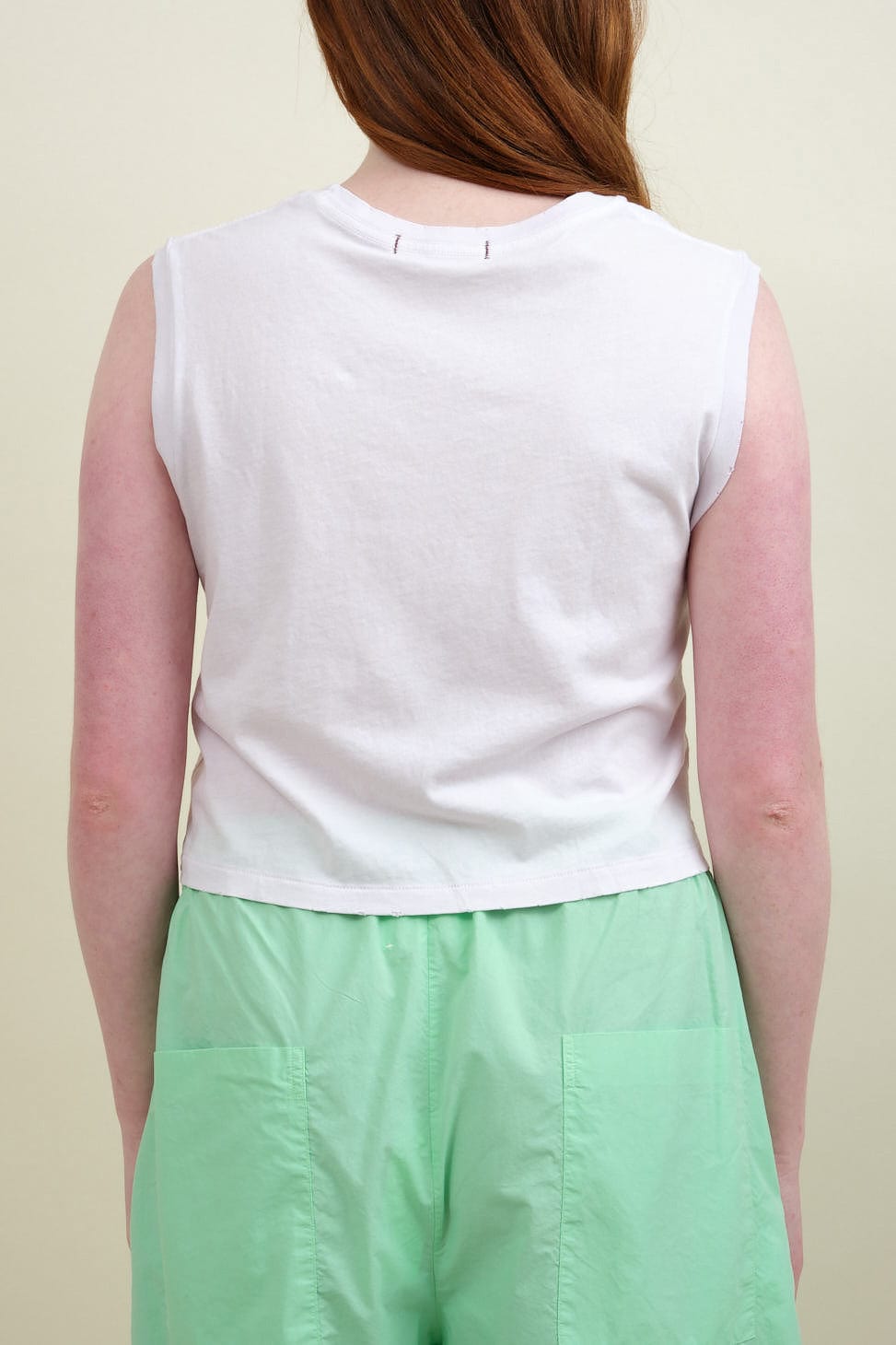 Back of Sleeveless Babe Tee in Blush