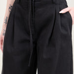 Pockets and pleats on Panjim Pleated Denim Trousers