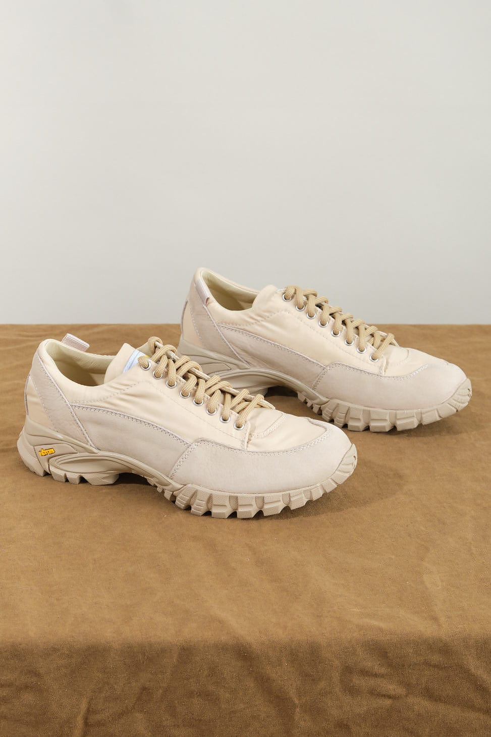 Possagno Shoe in Sand Bomber on table