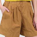Pocket view of Thal Shorts in Clay
