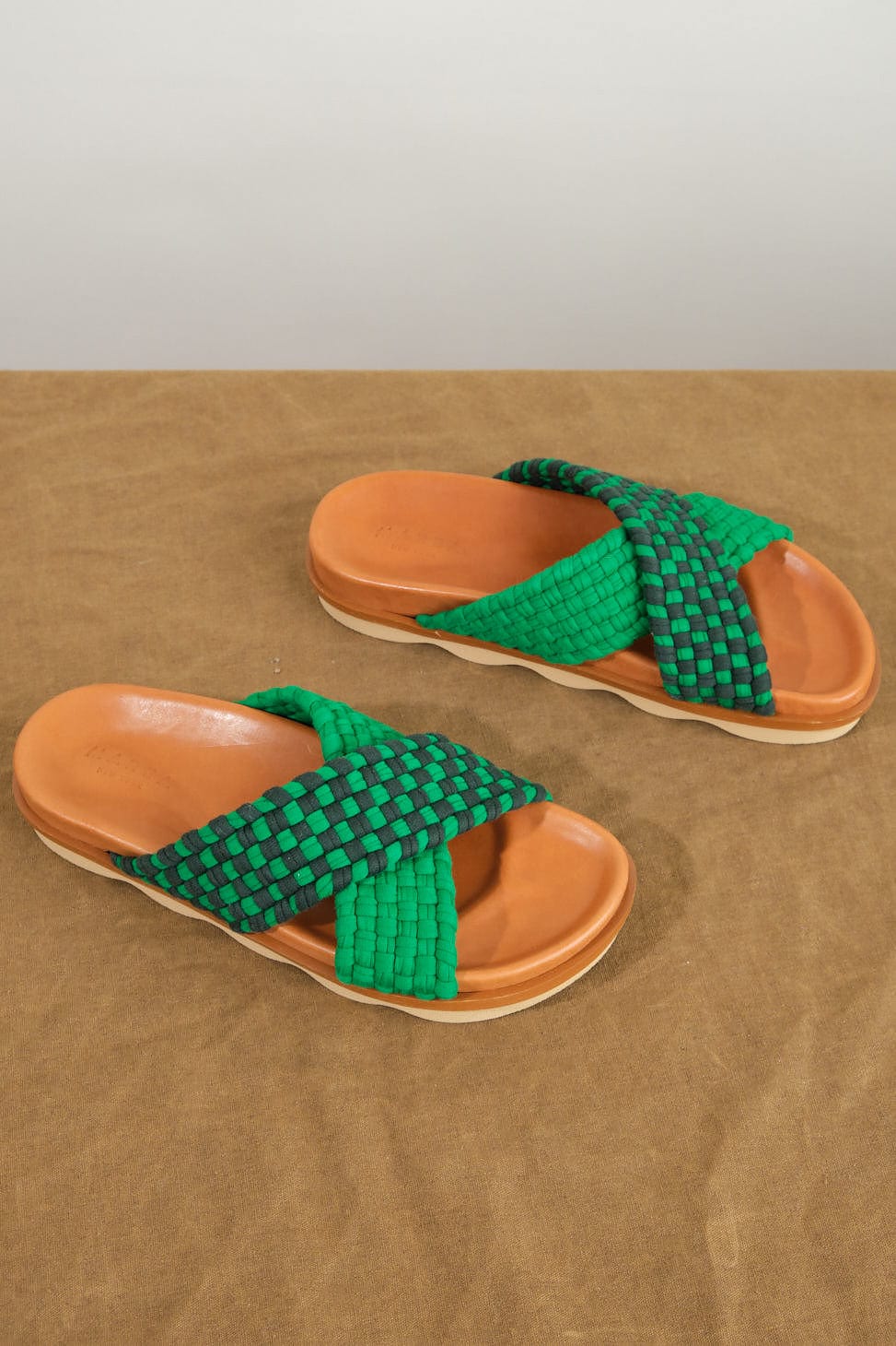 Crossover Wave Sole Sandal in Green/Dark Green on table