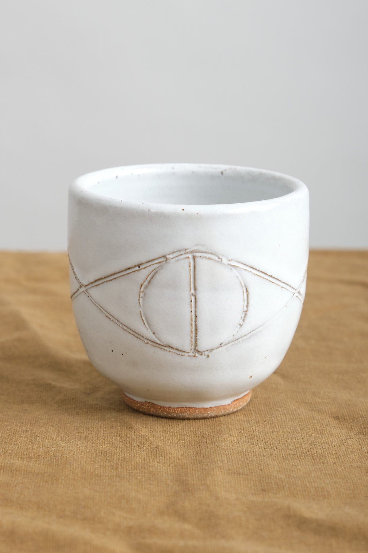 Ceramic Felix Cup in White with Evil Eye Design
