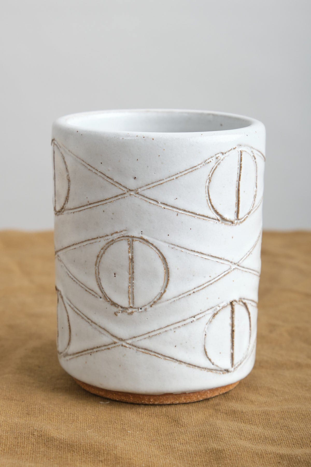 Felix Tumbler in White with hand-carved eye ball designs