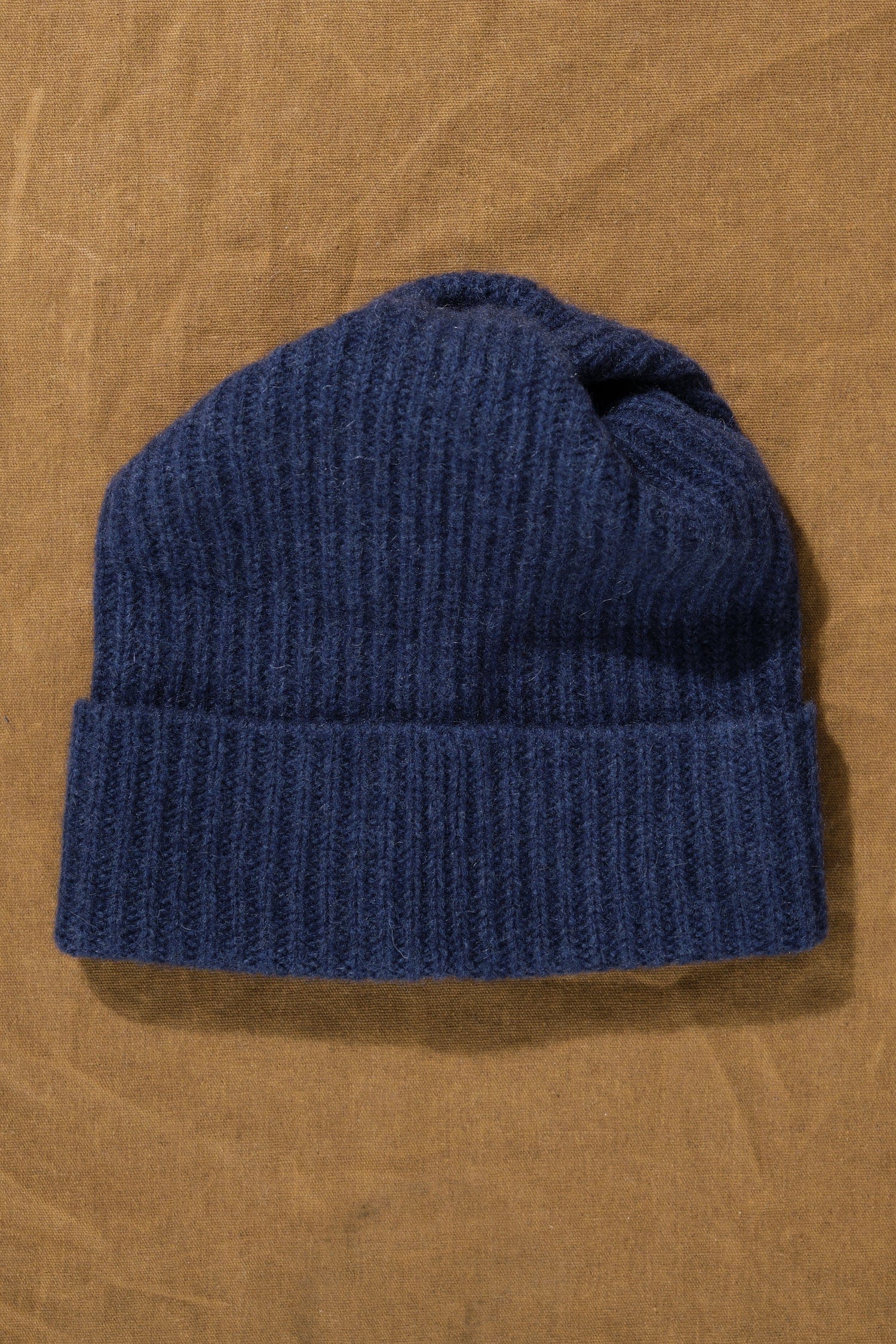 Pleats Knit Cap in Indigo on table