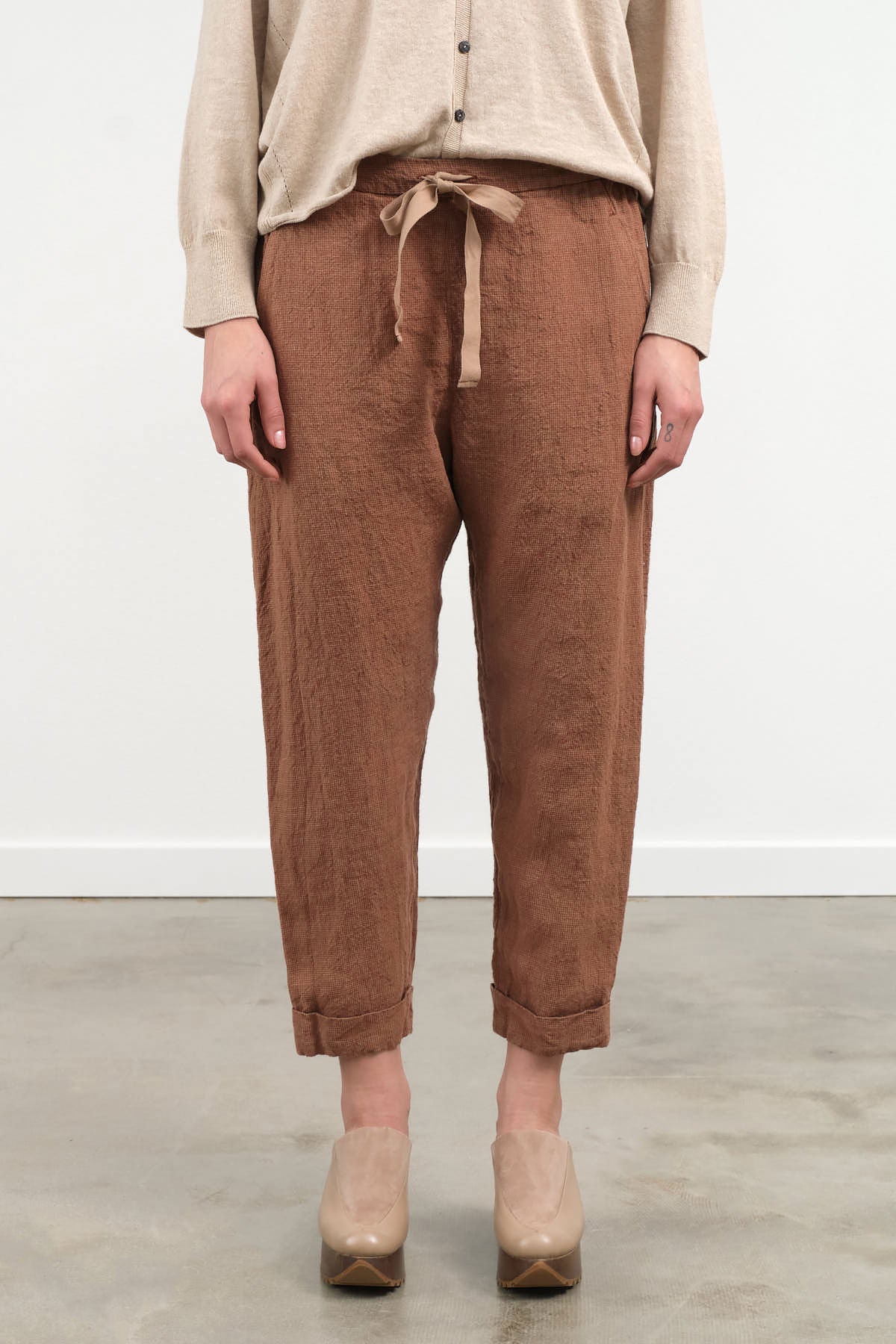 Front view of Houndstooth Cuffed Pants in Brick