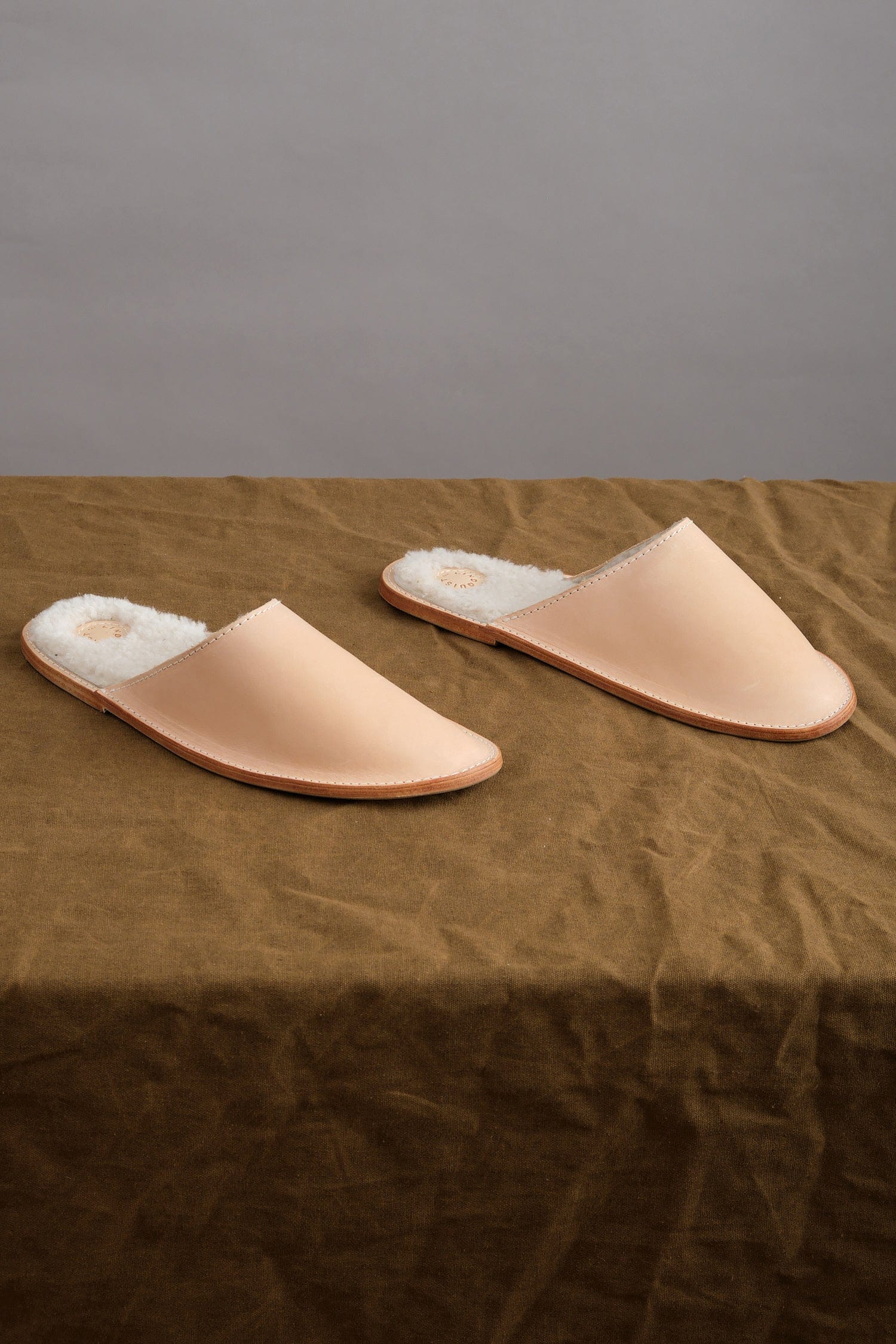 Louil House Shoe in Vachetta on table