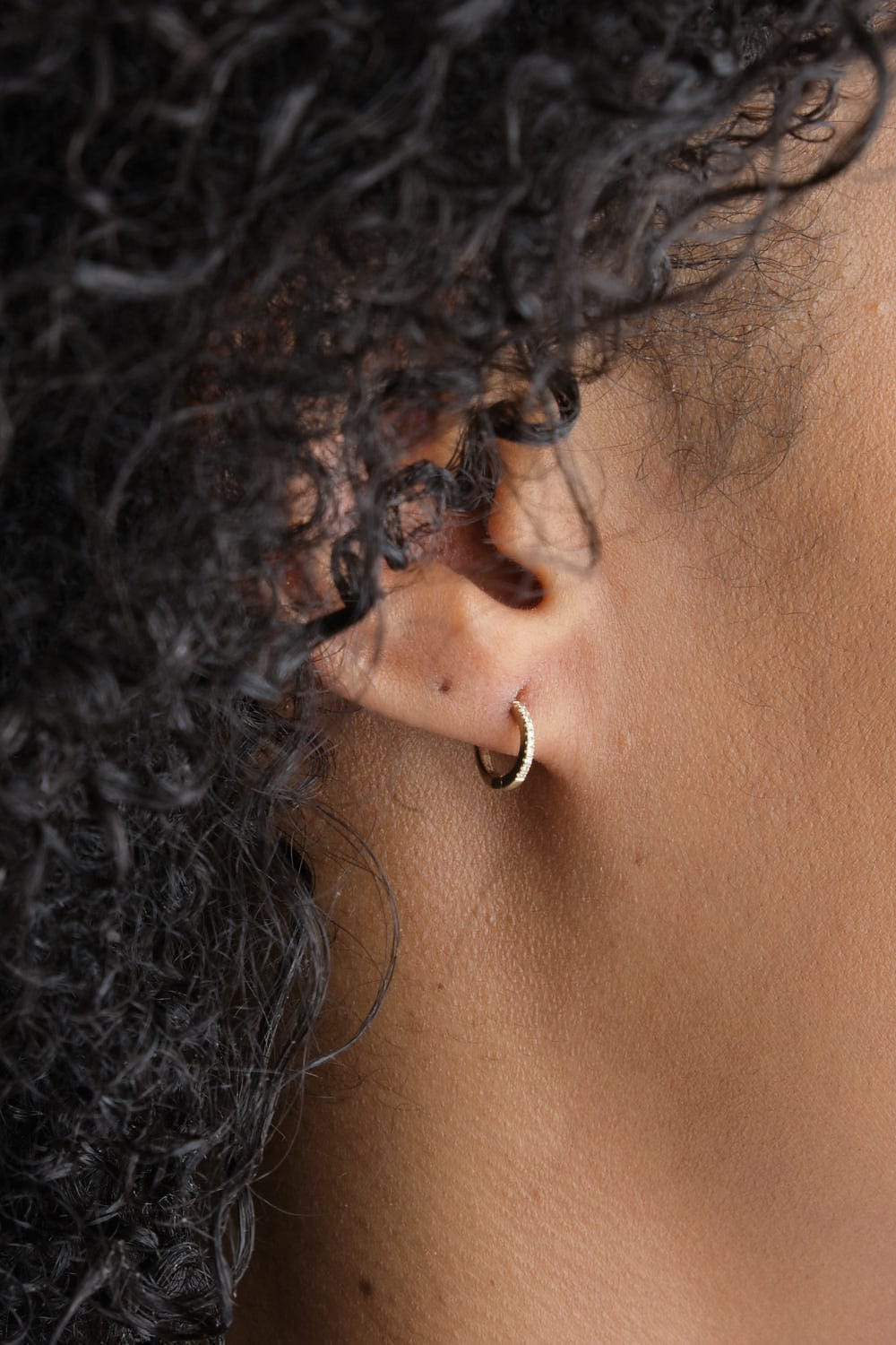 8mm Pave Satin Huggie on ear