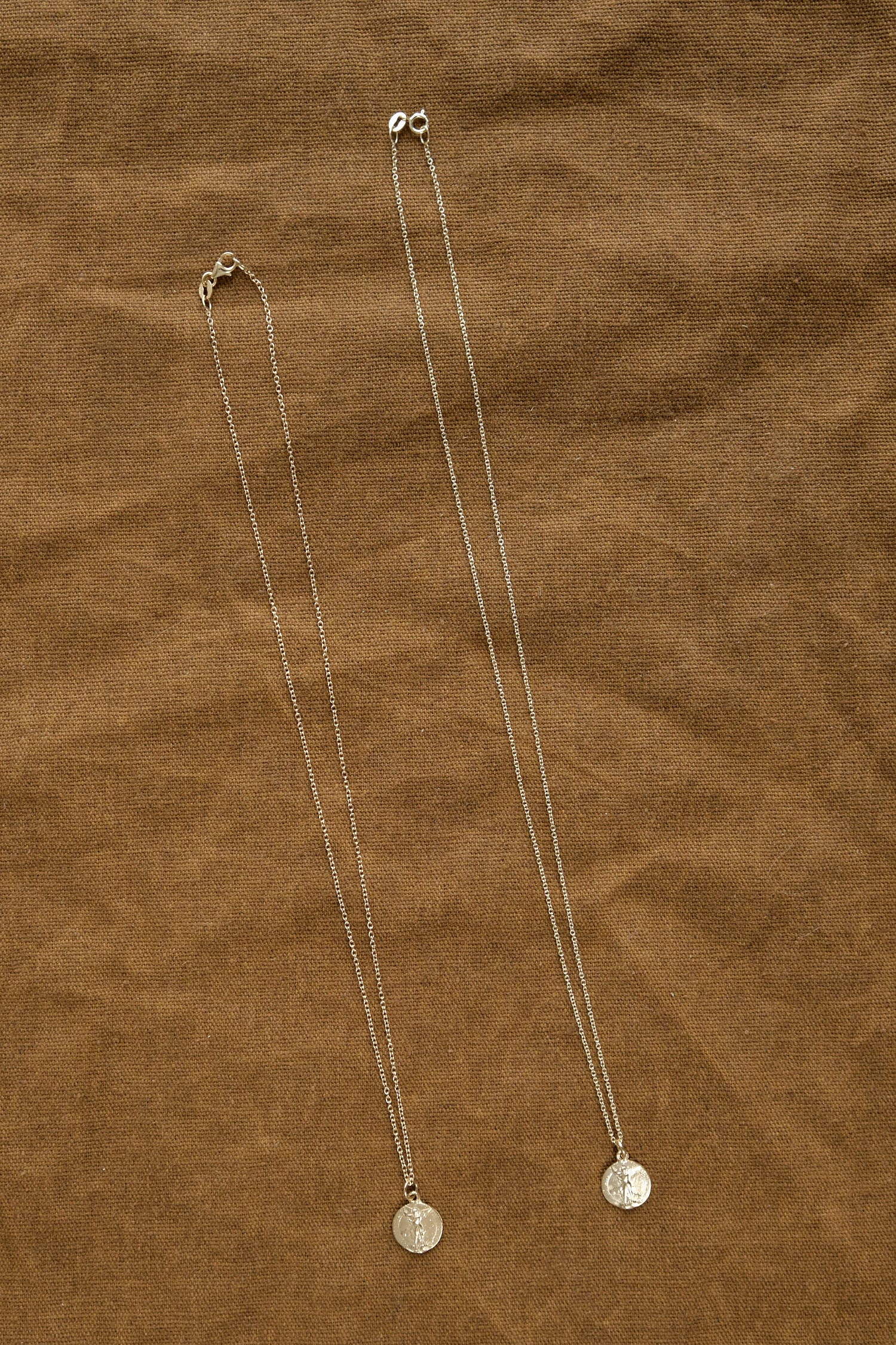 18" Inch Guardian Coin Necklace next to 16"