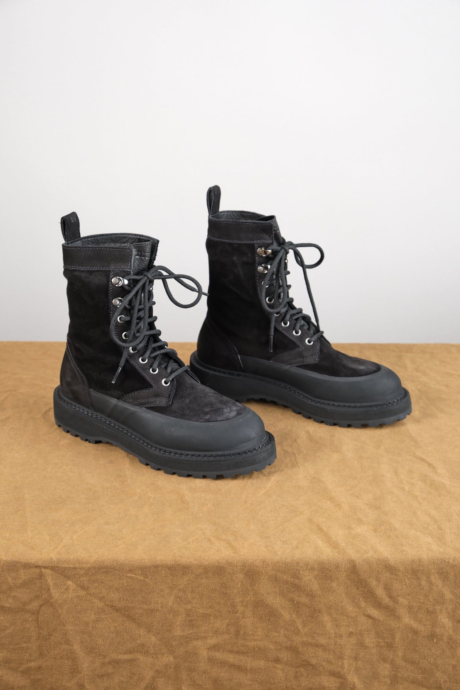 Altivole Due Boot in Black Suede on table