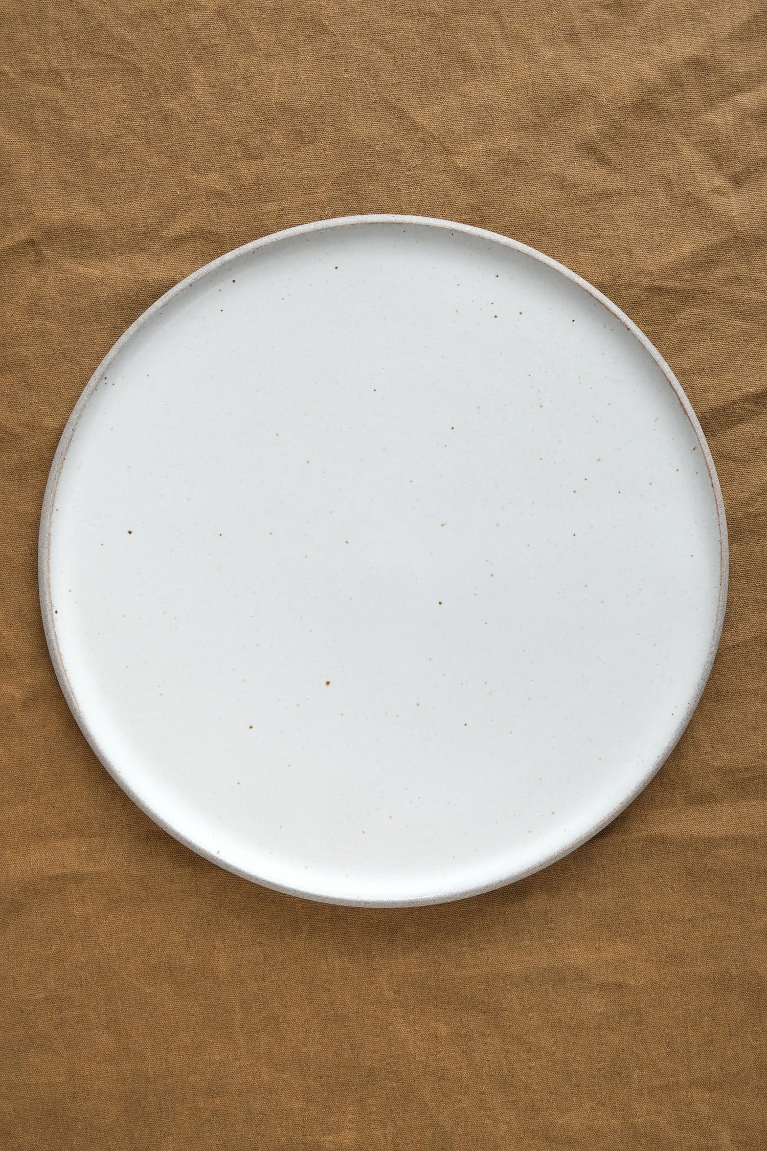 Top of 11" Stillness Plate in Greystone/Snow White
