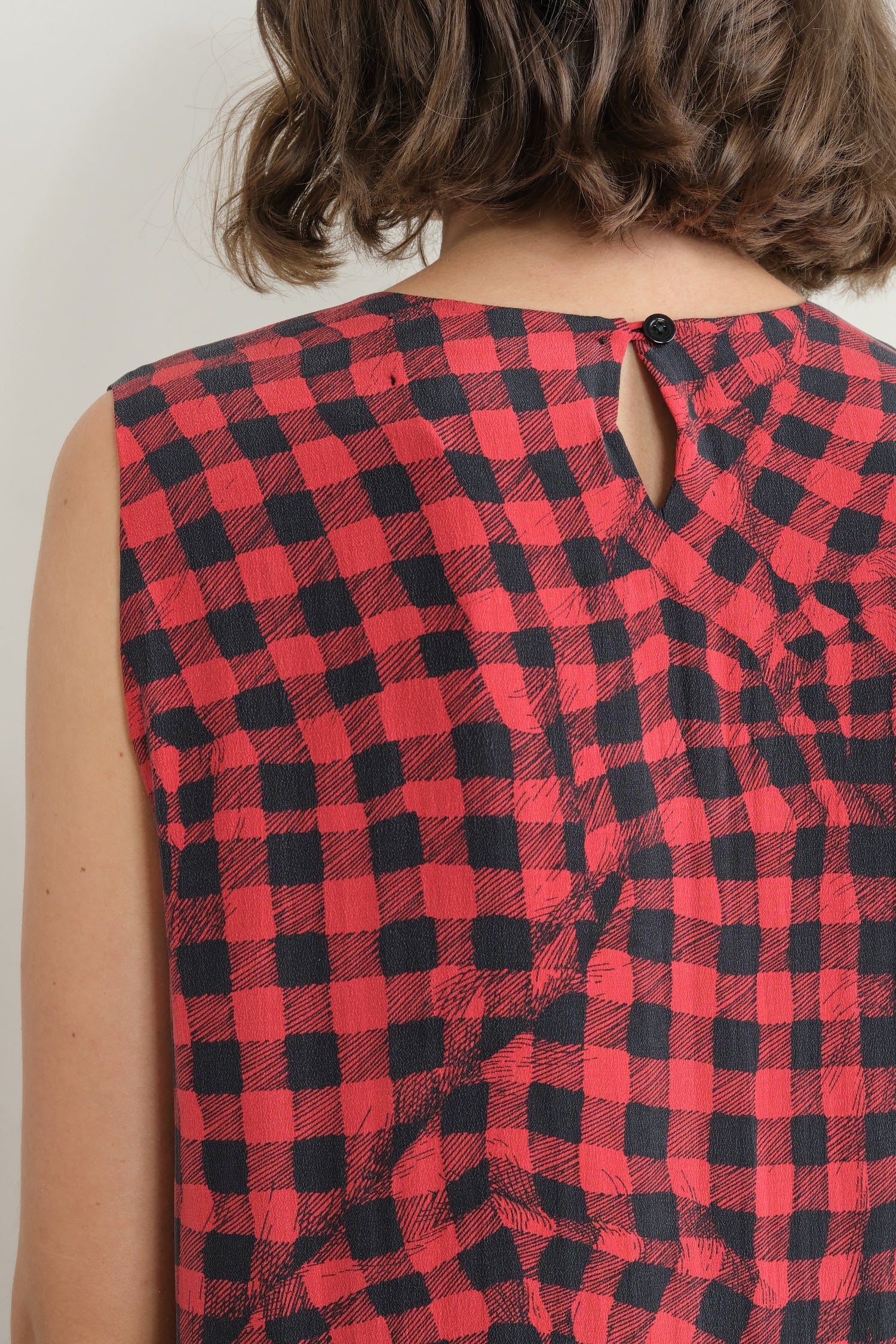 Button closure on Edith Dress in Red