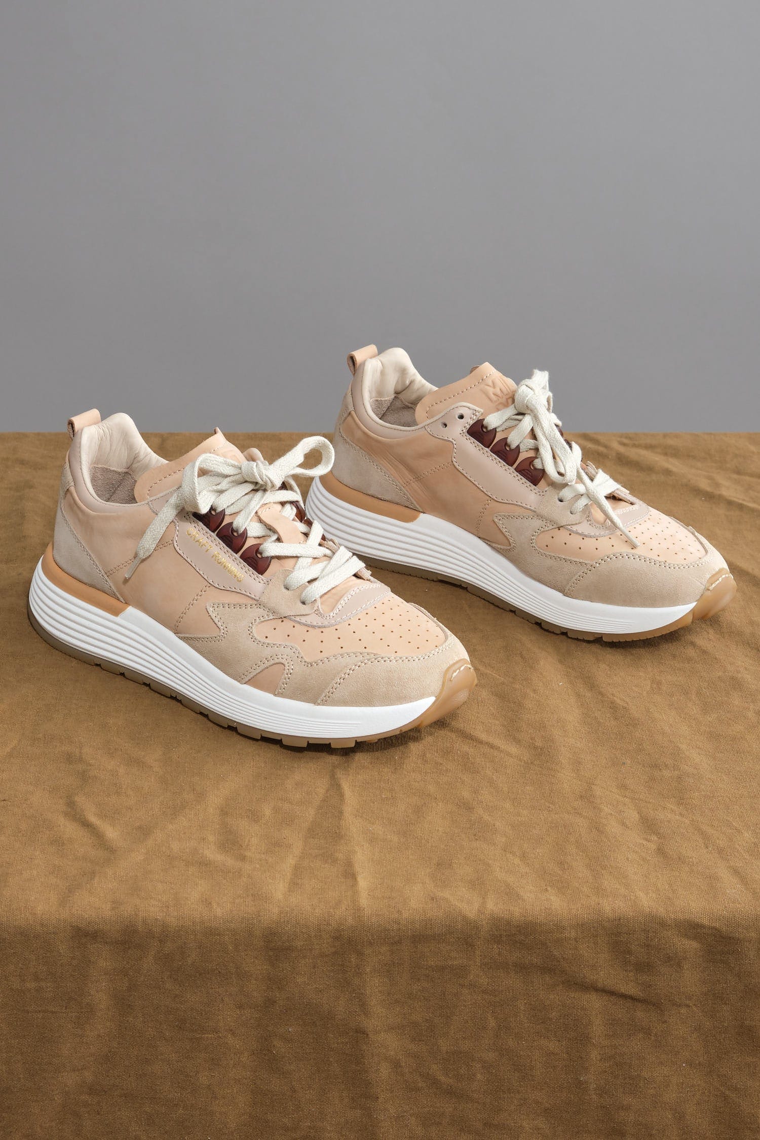 Moma Crafts Running Sneakers on table