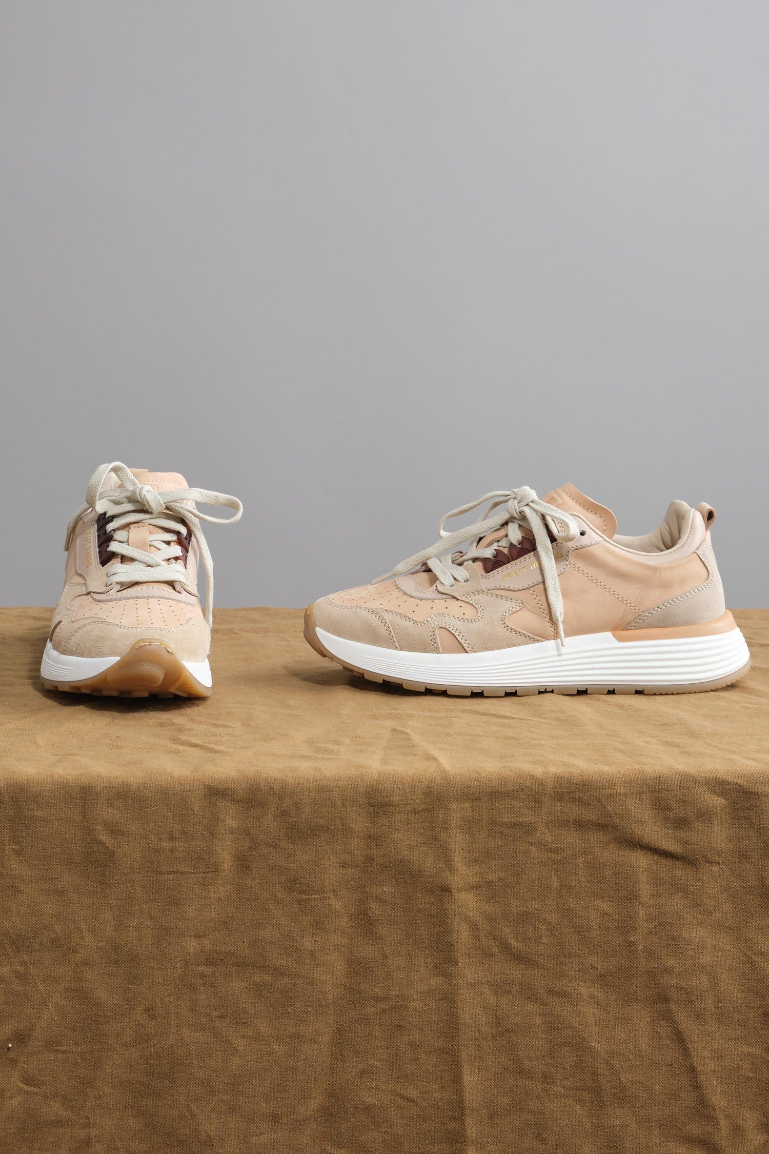 Moma Crafts Running Sneakers on table