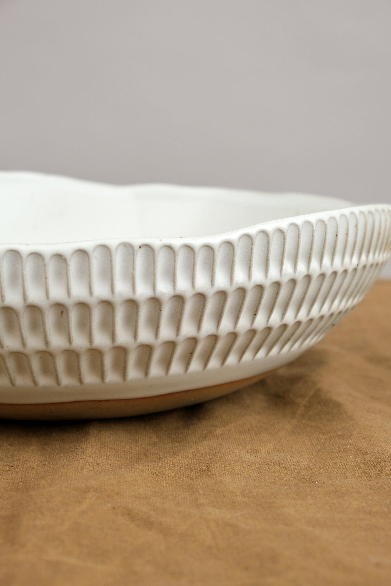 Carved Eggshell Serving Bowl in White Mt. Washington Pottery