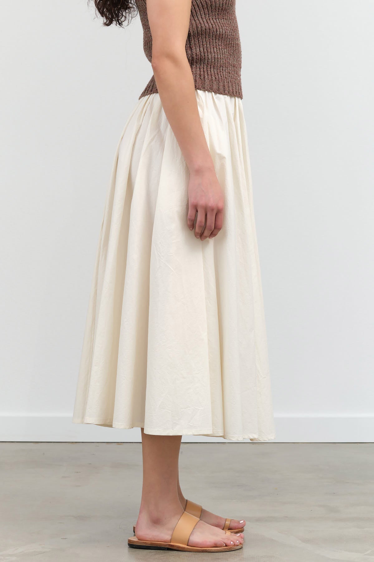 Side view of Papery Elastic Prairie Skirt in Off-White