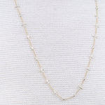 Notes Necklace by Hannah Keefe in Brass and Silver Solder