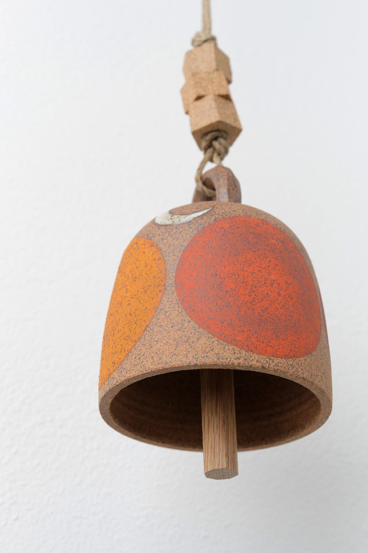 MQuan Ceramic Small Round Thrown Bell in Tucker Four Rainbow Design Hanging from Rope 