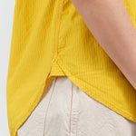 Side hem view of Ruth Sleeveless Shirt in Lemon
