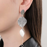 Annie Costello Brown Jewelry Earrings Asymmetrical Stacked Coins Earrings Sterling Silver / 4.75" L