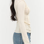 Baserange Designer Brand Omato Long Sleeve Fitted Top with Exposed Seams in Off White Cream 