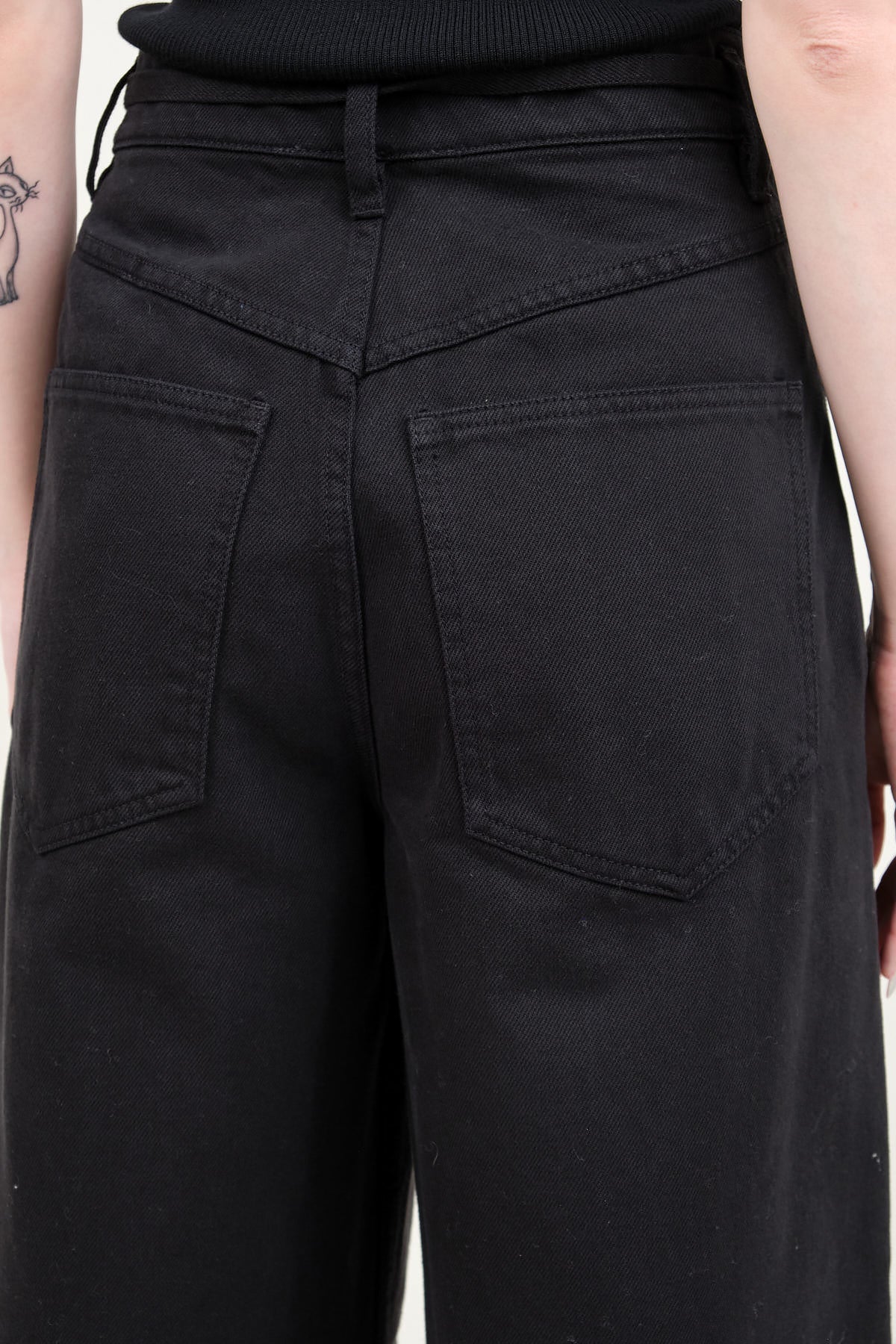 Back pockets on Panjim Pleated Denim Trousers
