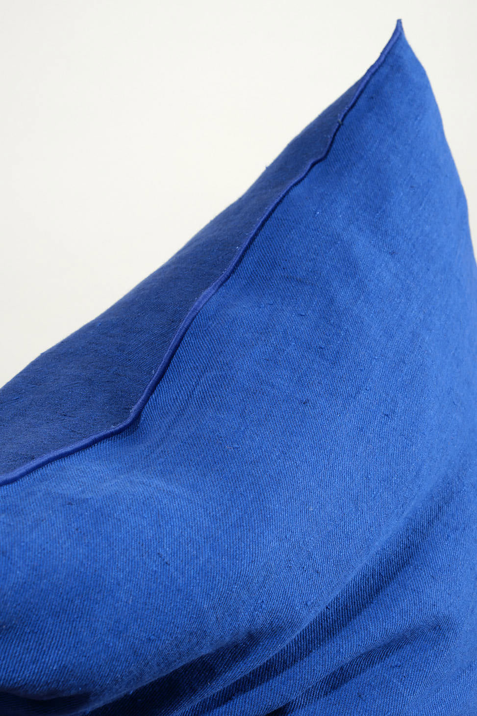 Closeup of 26" X 26" Crumpled Washed Linen Vice Versa Cushion in Cobalt