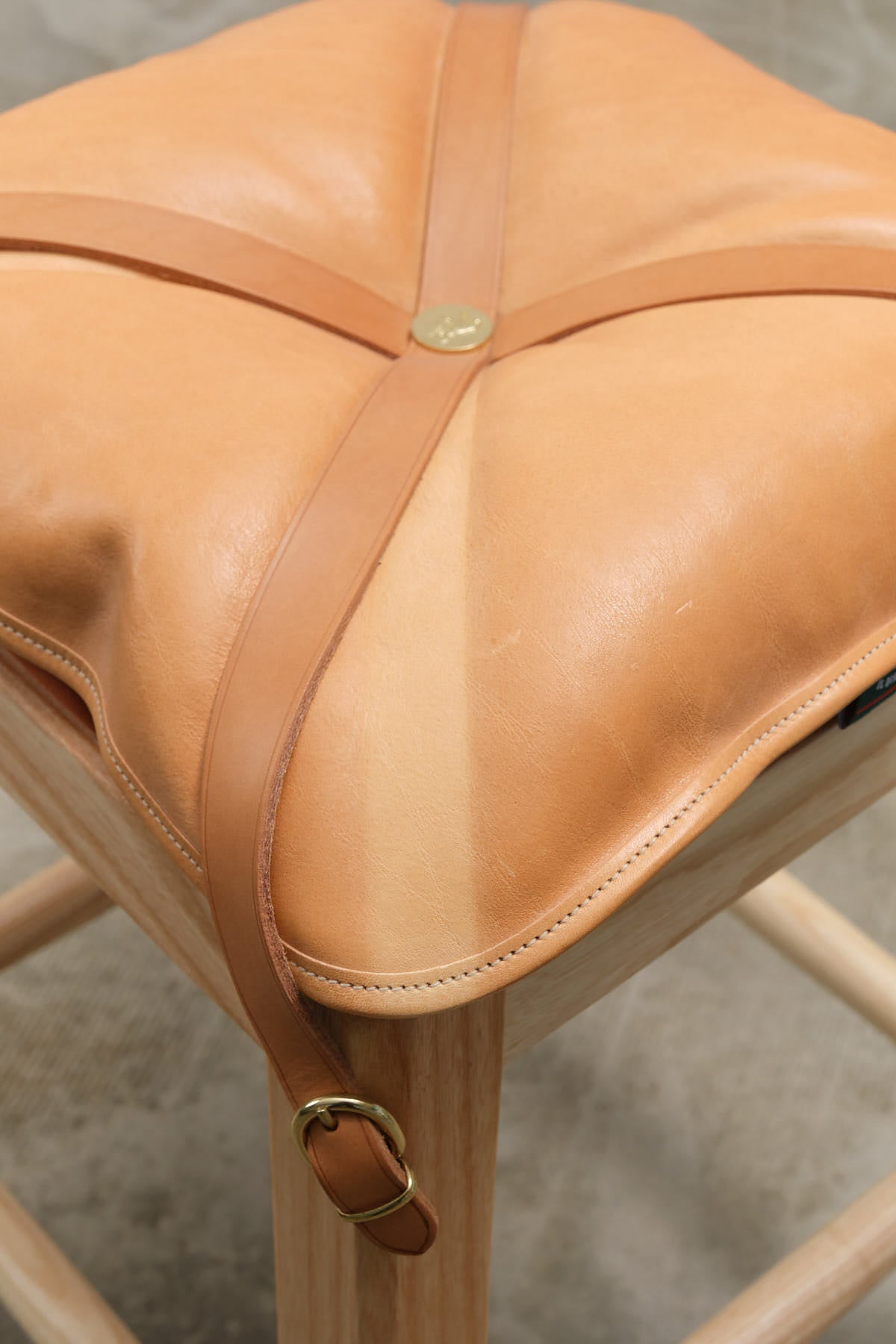 Il Bisonte Leather Short Cowhide Stool with Pillow and Brass Buckle in Naturale Tan