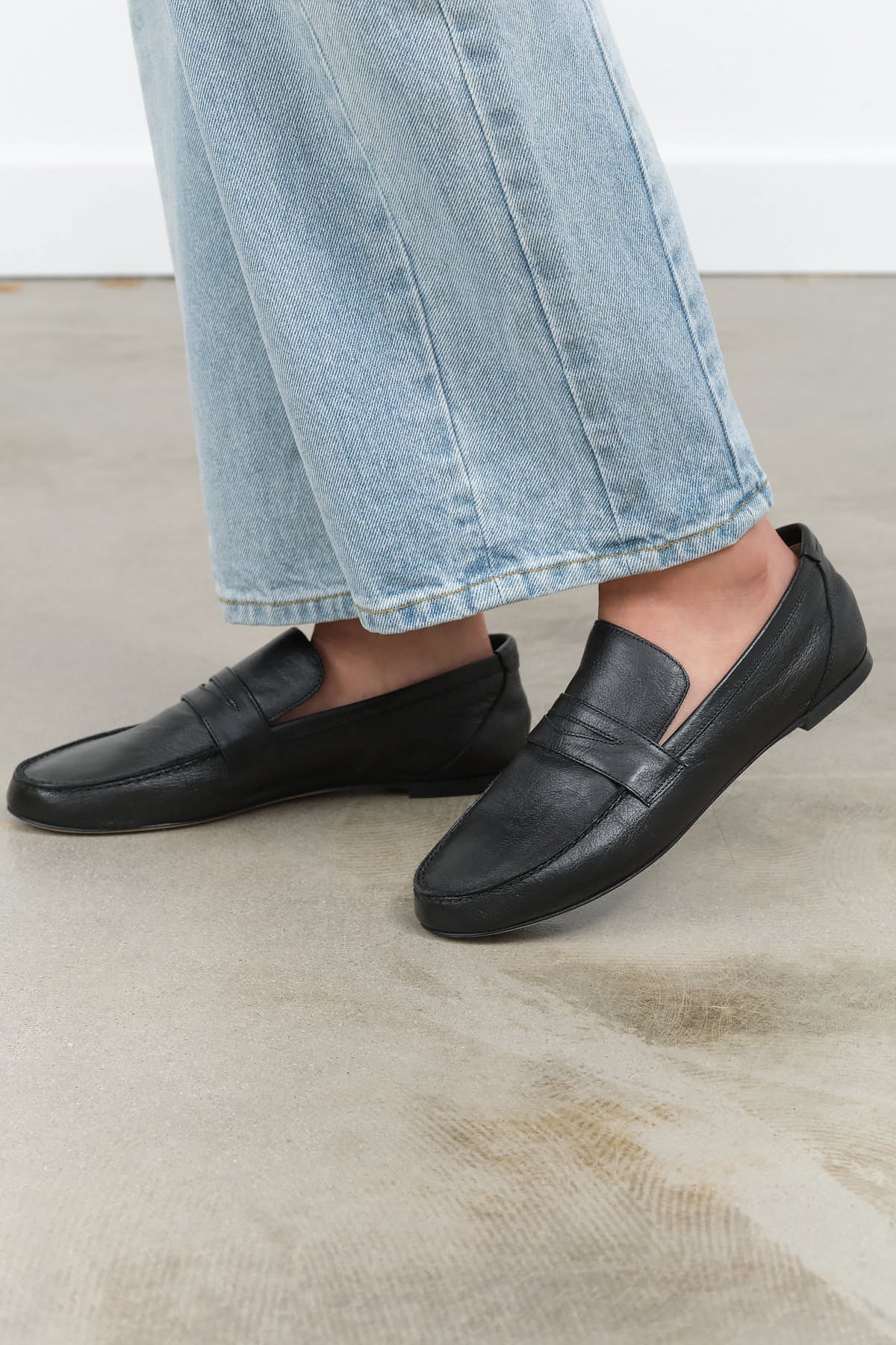 Lifted view of Penny Loafer in Black
