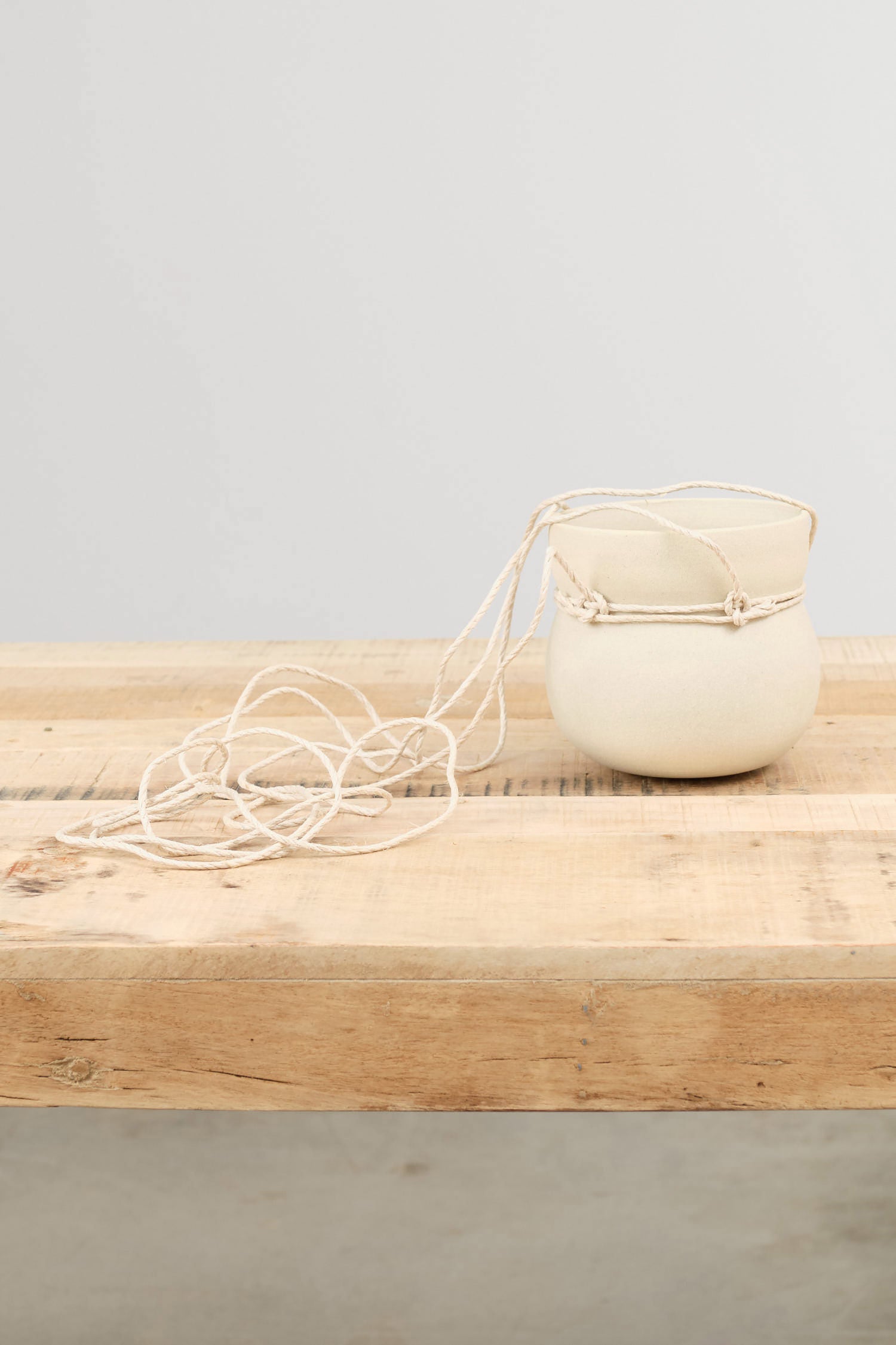 White Stoneware Hanging Cinched Planter by Kati Von Lehman