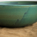 Unique handmade serving bowl with Emerald glaze and speckled details