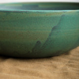 Unique handmade serving bowl with Emerald glaze and speckled details