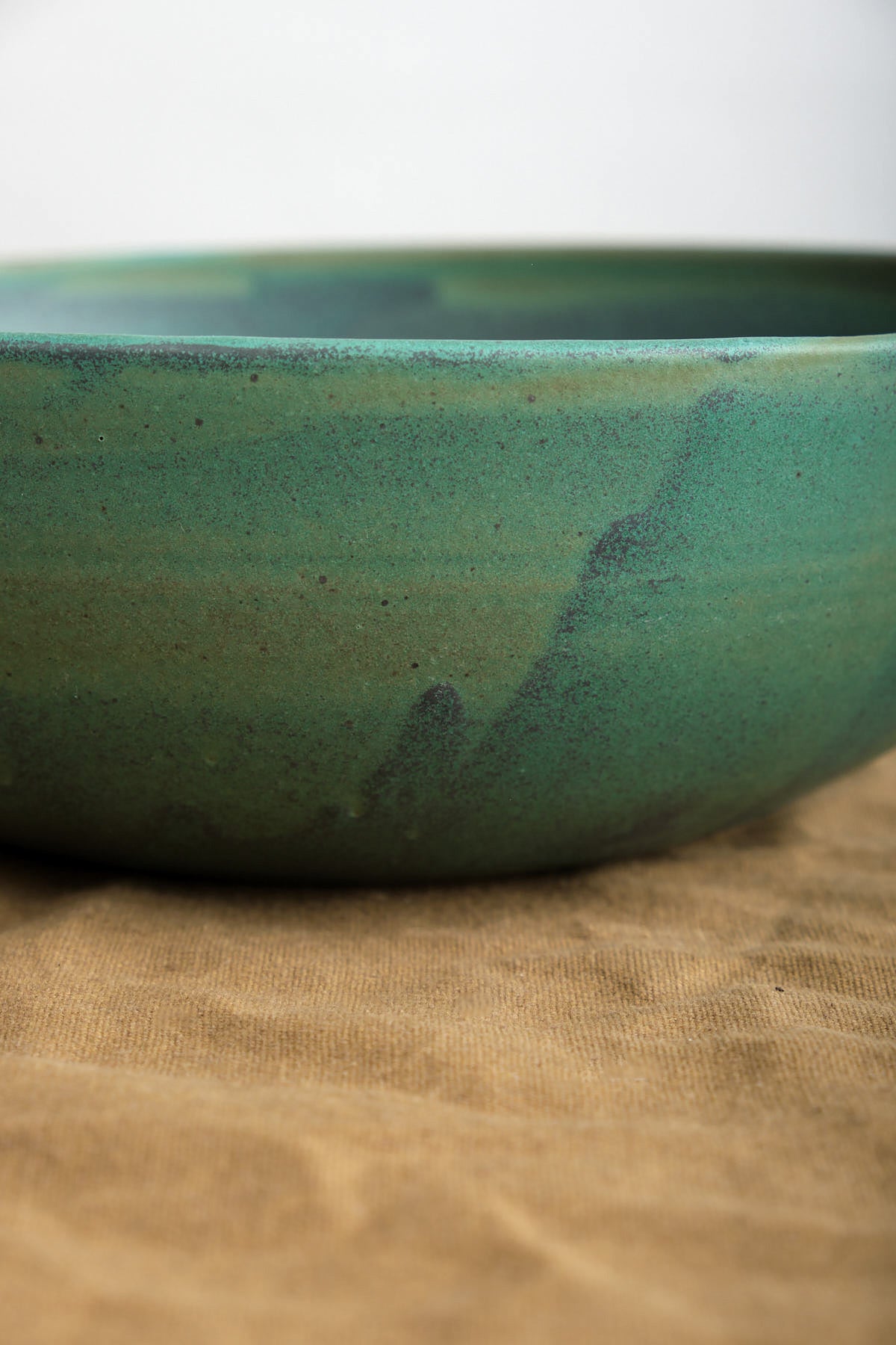 Unique handmade serving bowl with Emerald glaze and speckled details