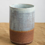 Kati Von Lehman Tumbler in Brownstone with natural base and  Shino glaze on top  