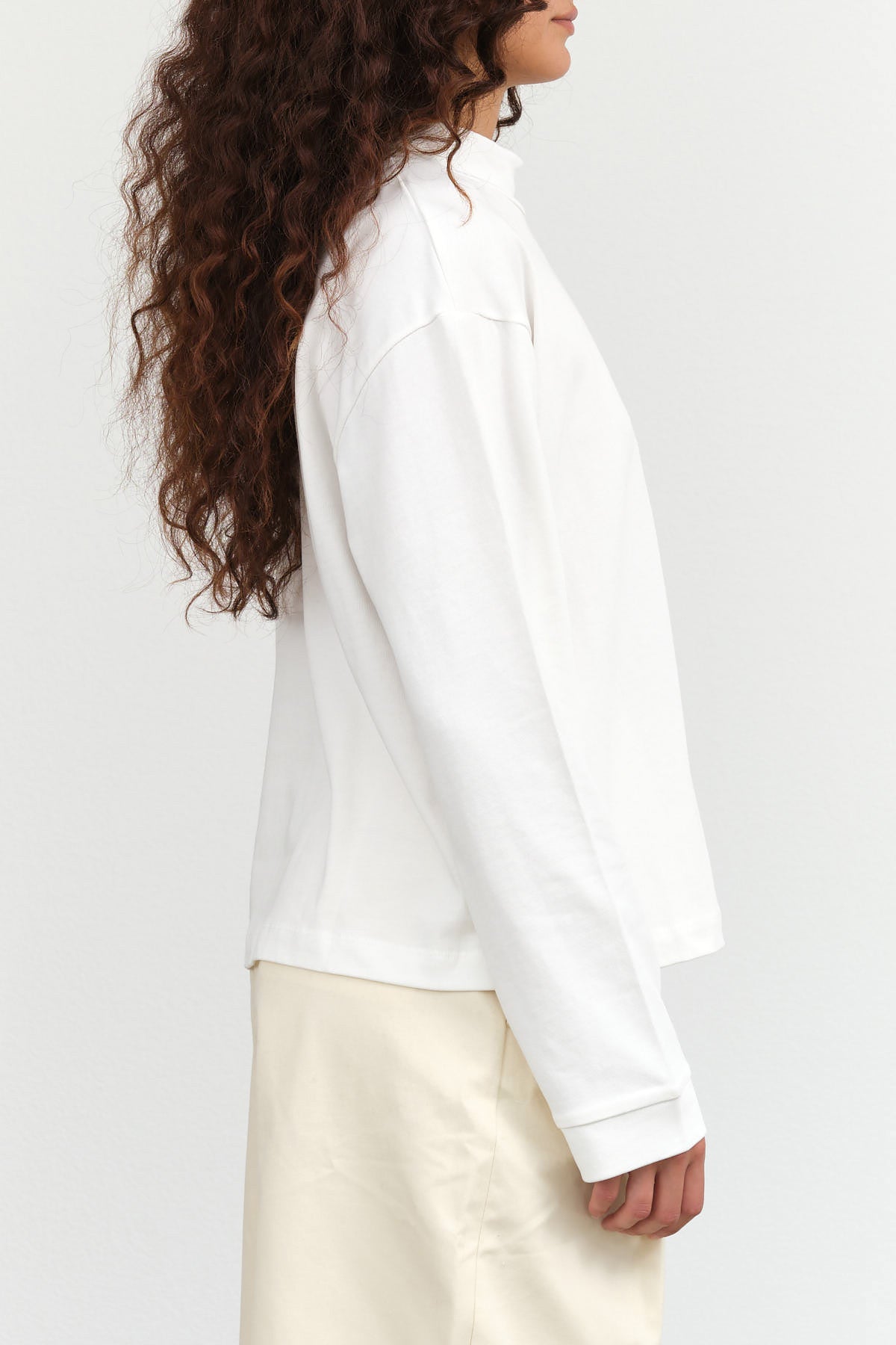 Kowtow Designer Brand Cotton Long Sleeve Mock Neck Reflect Top in Off White