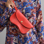 Styled view of Faba Bag in Persimmon