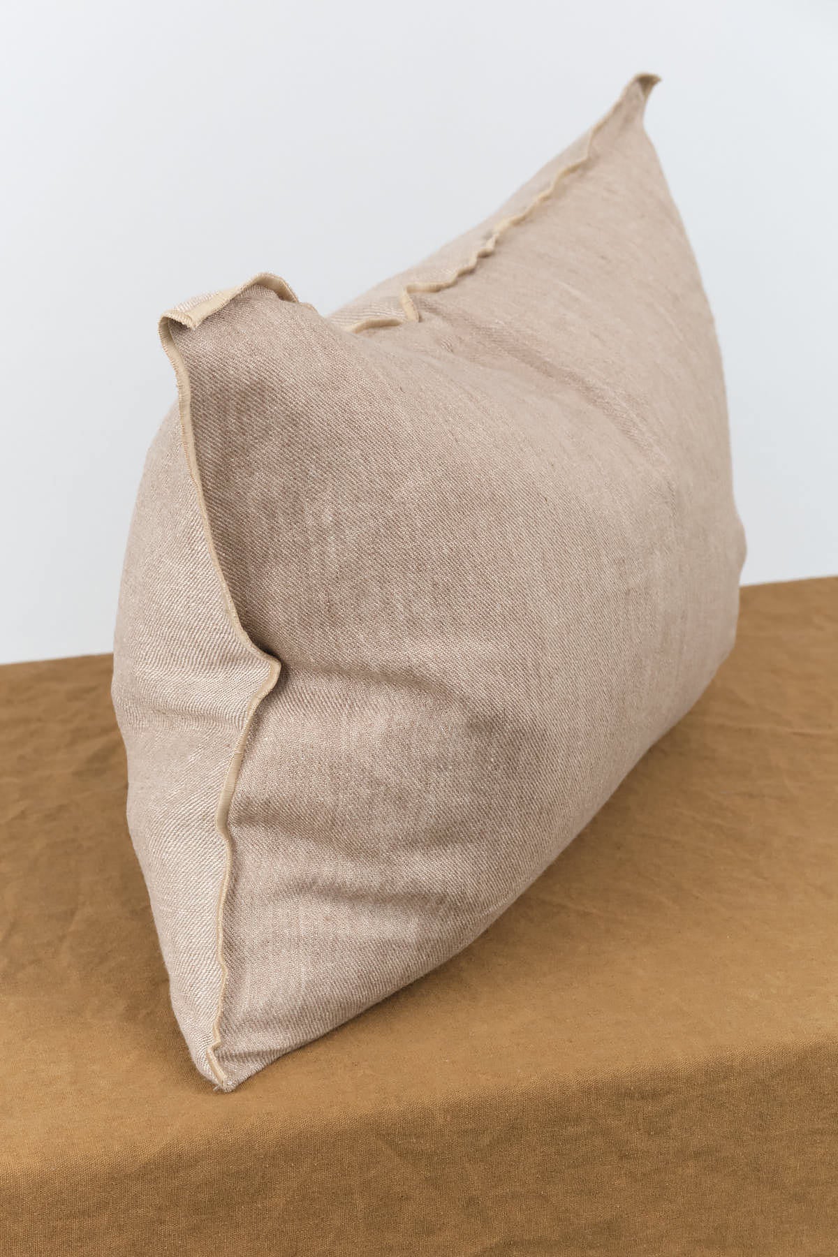Side view of 16" X 24" Washed Linen Vice Versa Cushion in Taupe