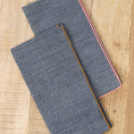 Mi Cocina Dobby Chambray Napkin in Shrimp and O'Keefe Cedar