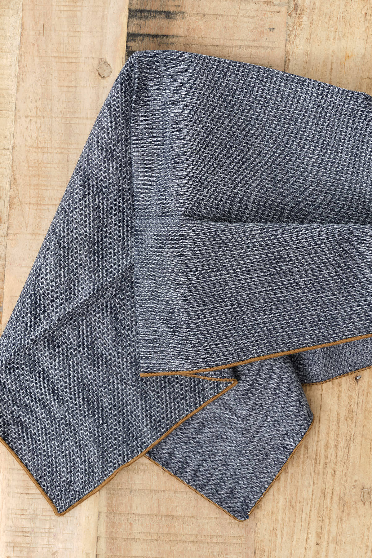 Dobby Chambray Napkin in O'Keefe Cedar Brown and Blue by Mi Cocina