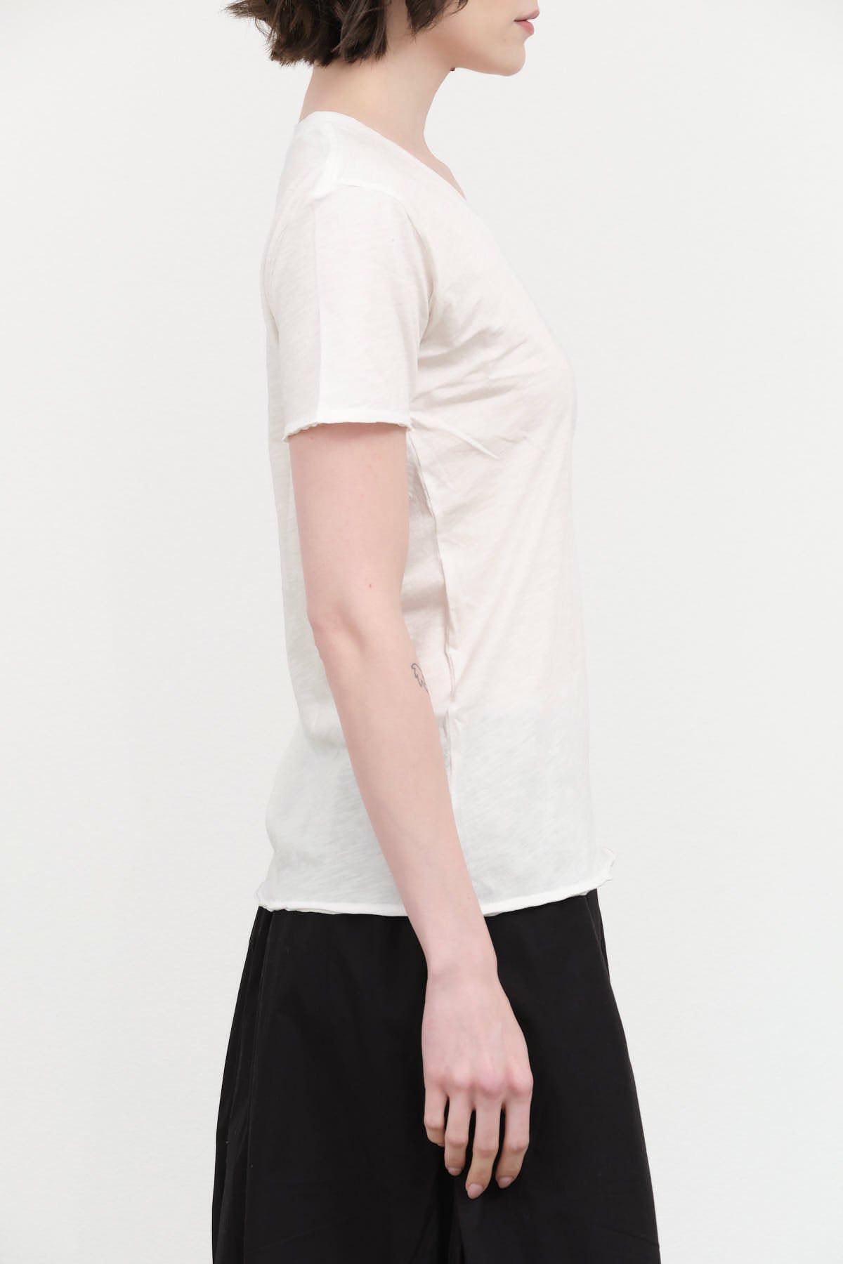 Side view of Cora V Neck Tee in Soft White
