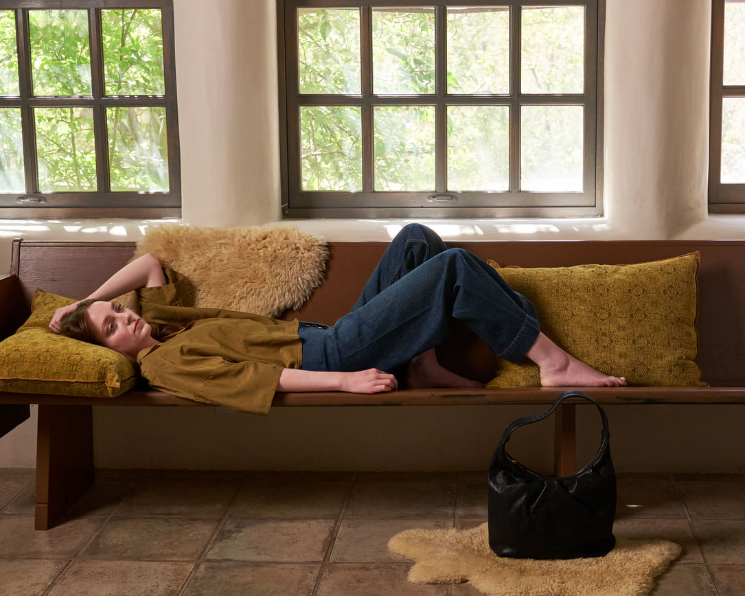 A women on vacation with designer clothing from Jesse Kamm and Black Crane.