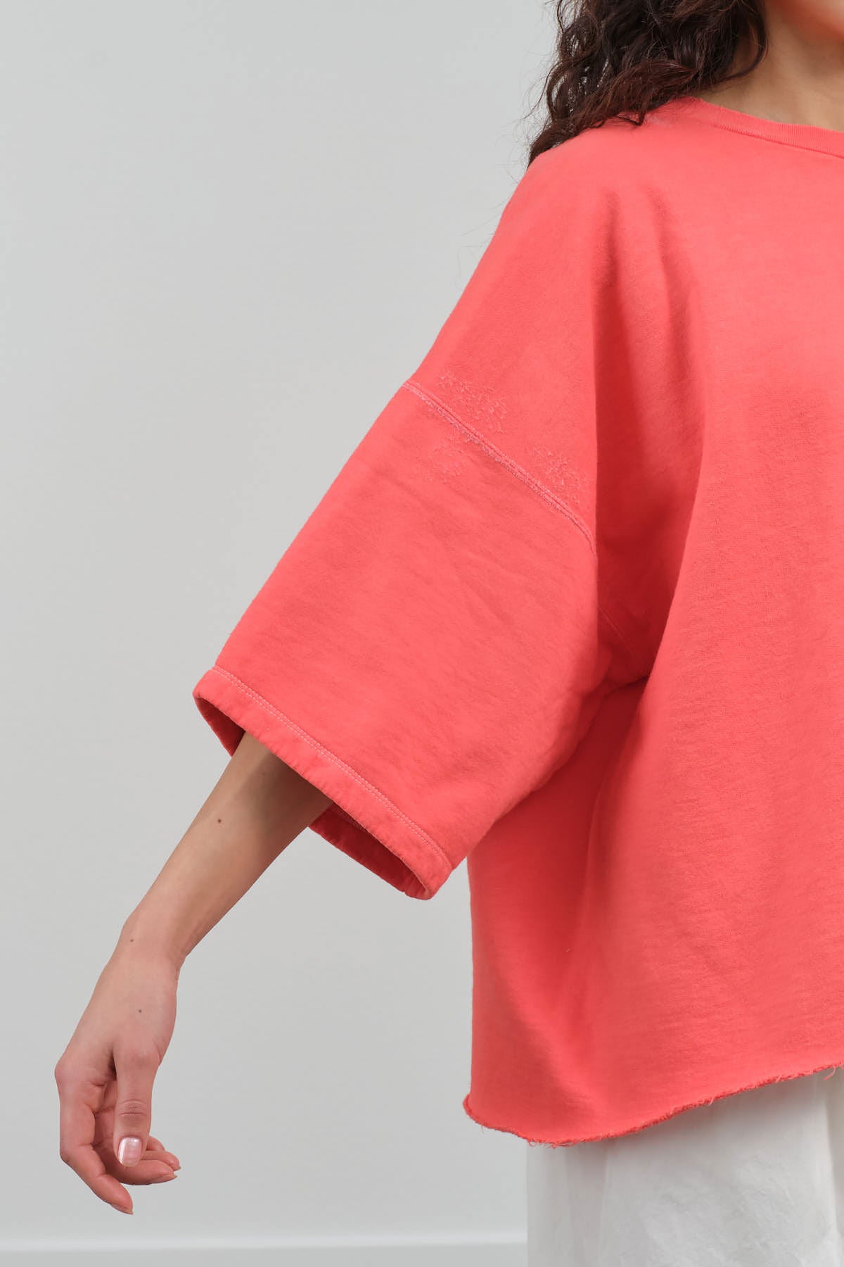 Sleeve view of Fondly Sweatshirt in Guava