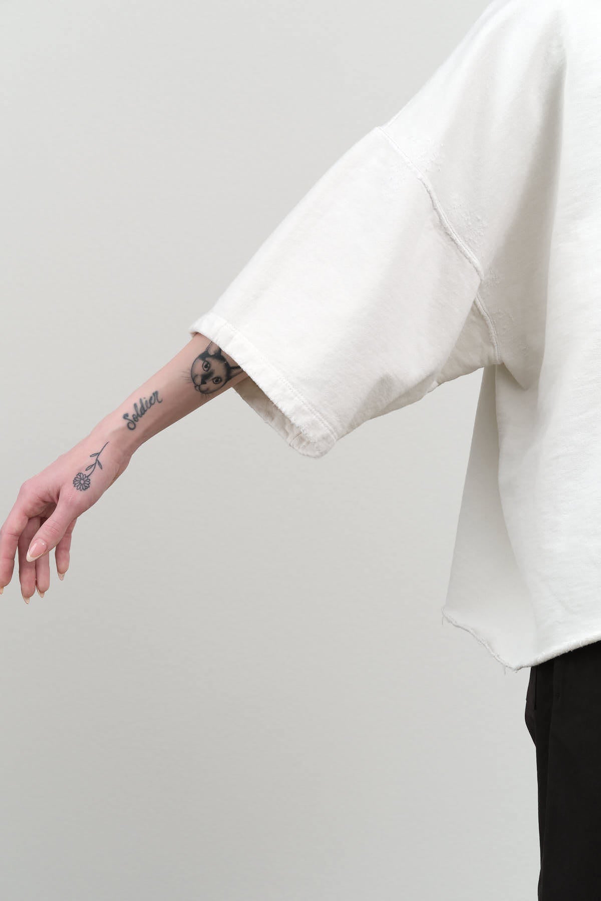 Sleeve view of Fondly Sweatshirt in Dirty White'