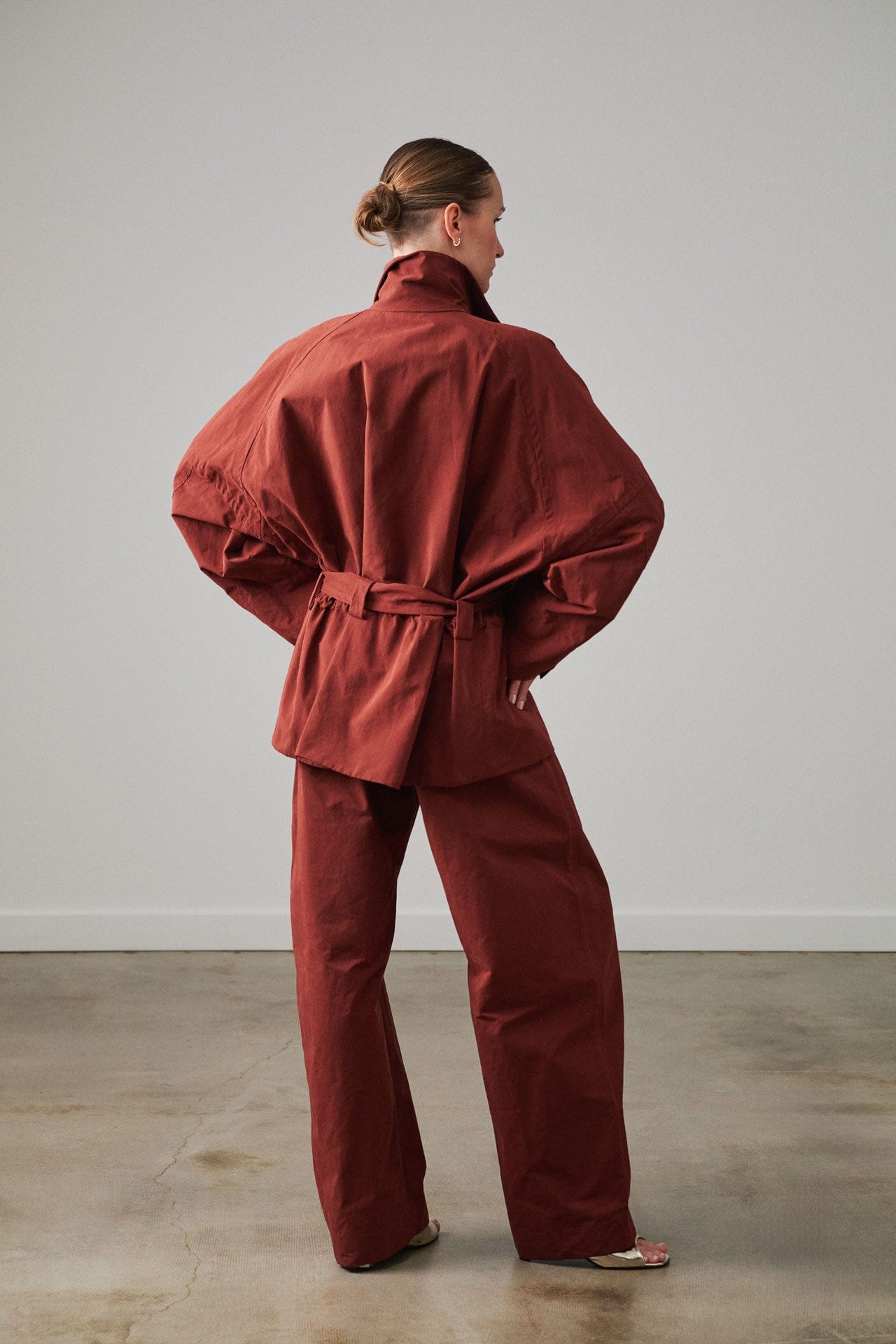 Person wearing new Rachel Comey from head to toe standing against a plain background