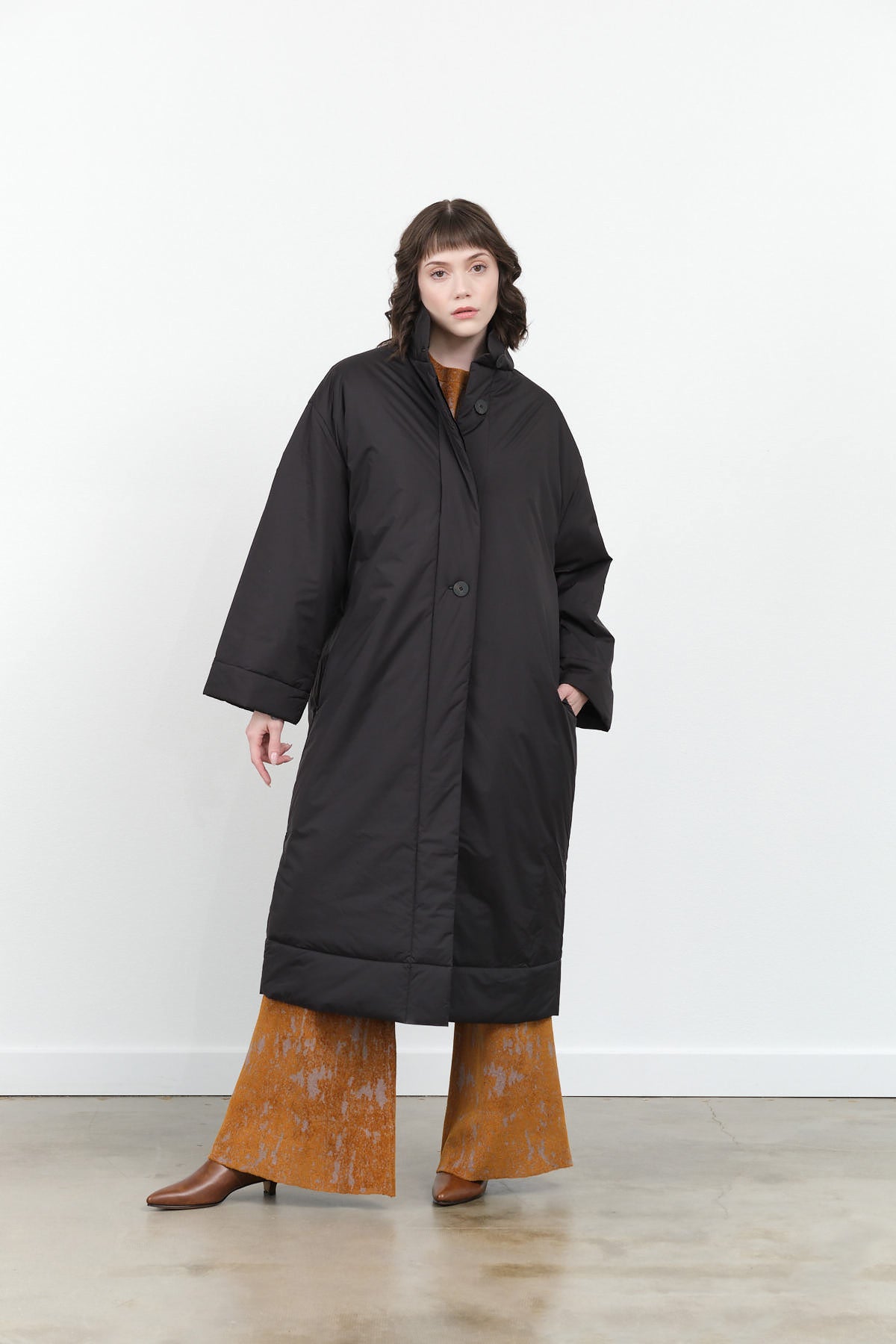 Studio Nicholson Pallan Padded Long Coat in Black