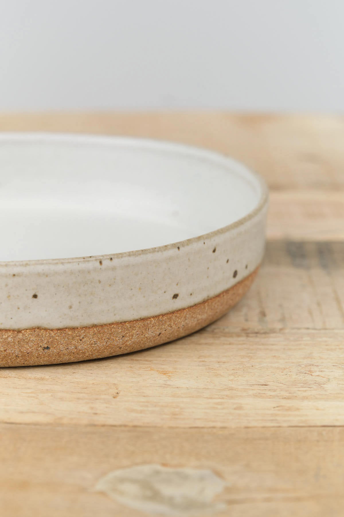 Half Dipped White Glaze Ceramic Medium Terra Deep Plate from Tomoro Pottery