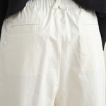 Back pockets on Elastic Drop Crotch Trousers in Off White
