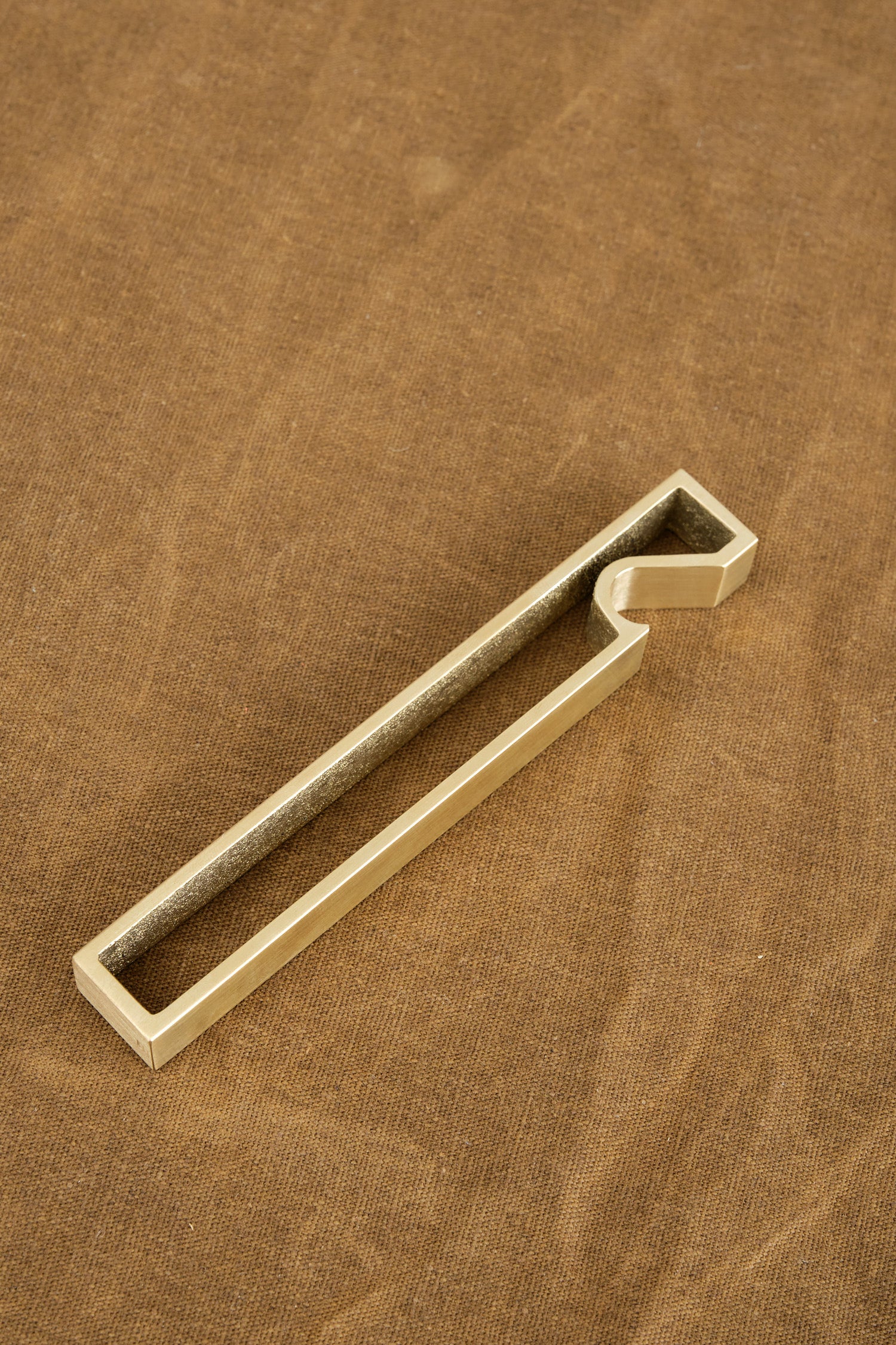 Solid brass bottle opener