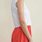 Side of Sleeveless Babe Tee in White