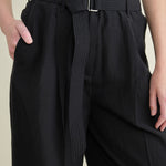 Front detailing on Pliza Pleated Trousers in Black