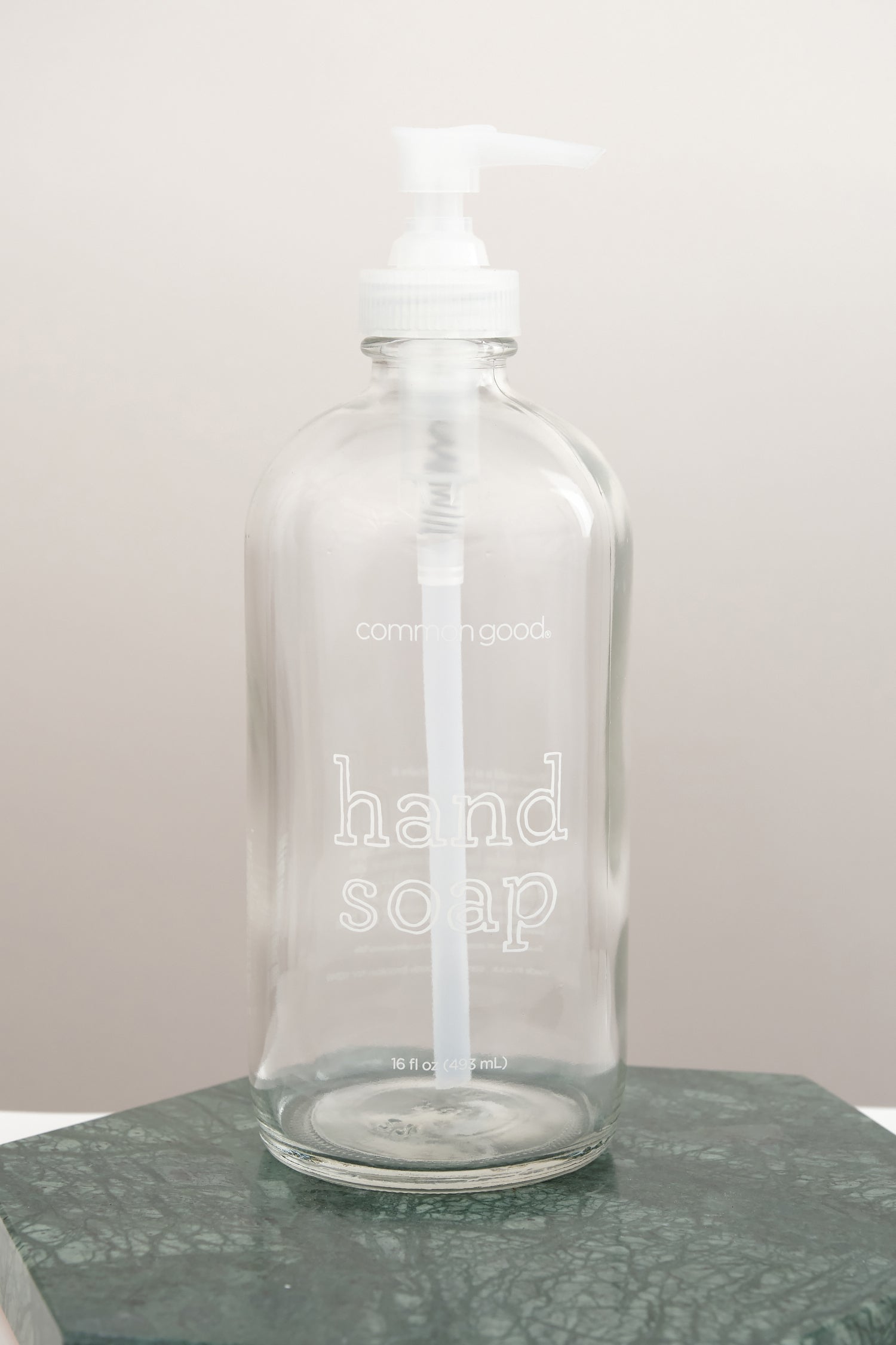 https://cedarandhyde.com/cdn/shop/products/common-good-empty-glass-soap-bottle1.jpg?v=1656617956